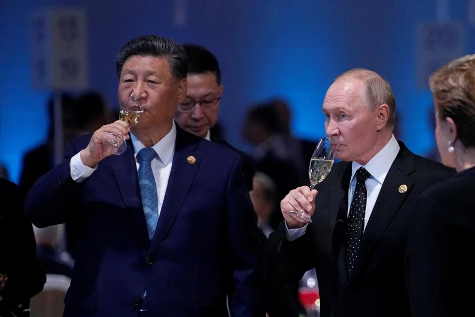 Russian President Vladimir Putin and Chinese President Xi Jinping at a reception of the BRICS summit in Kazan, Russia, on 23 October 2024. (Alexander Zemlianichenko/Reuters)