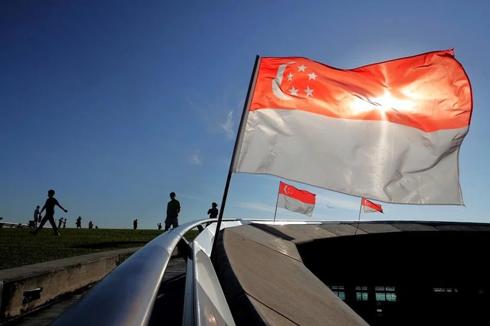 Singapore flags adorn Marina Barrage in Singapore. (SPH Media)