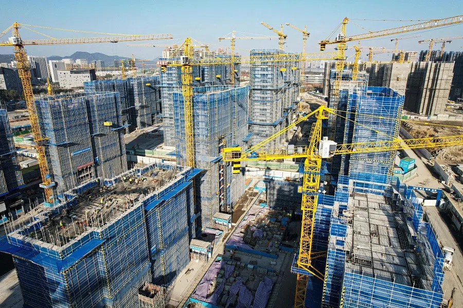 Residential buildings under construction by Chinese real estate developer Vanke in Hangzhou, Zhejiang province, China, on 15 March 2024. (AFP)