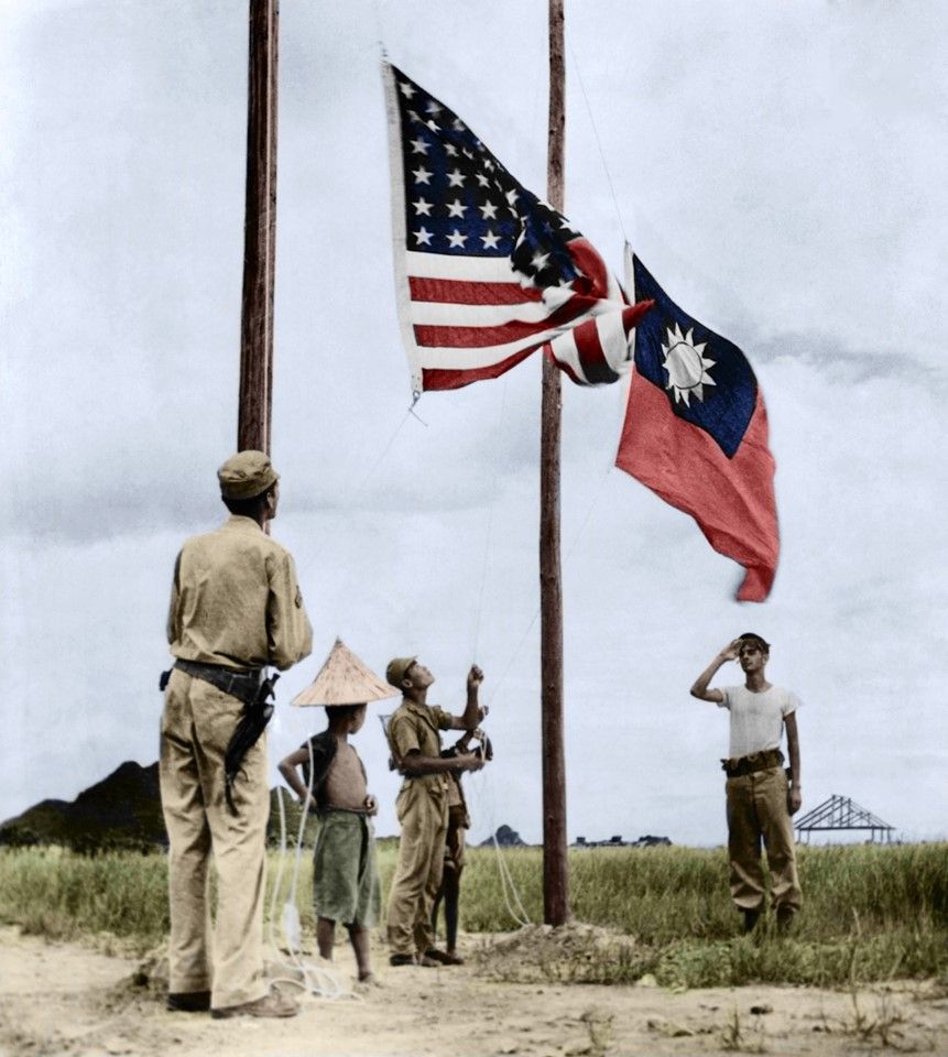 6 August 1945, Liuchow, Kwangsi (Guangxi) - The US and China's national flags are raised in victory over Liuchow, Kwangsi province. The city was once the base of the United States Army Air Forces (USAAF)'s 14th Air Force, which included members of the American Volunteer Group, commonly known as the Flying Tigers, under Lt. Gen. Claire Lee Chennault. The city was recaptured from Japanese occupation on 26 June 1945 to allow American airplanes to fly Chinese soldiers to front lines.