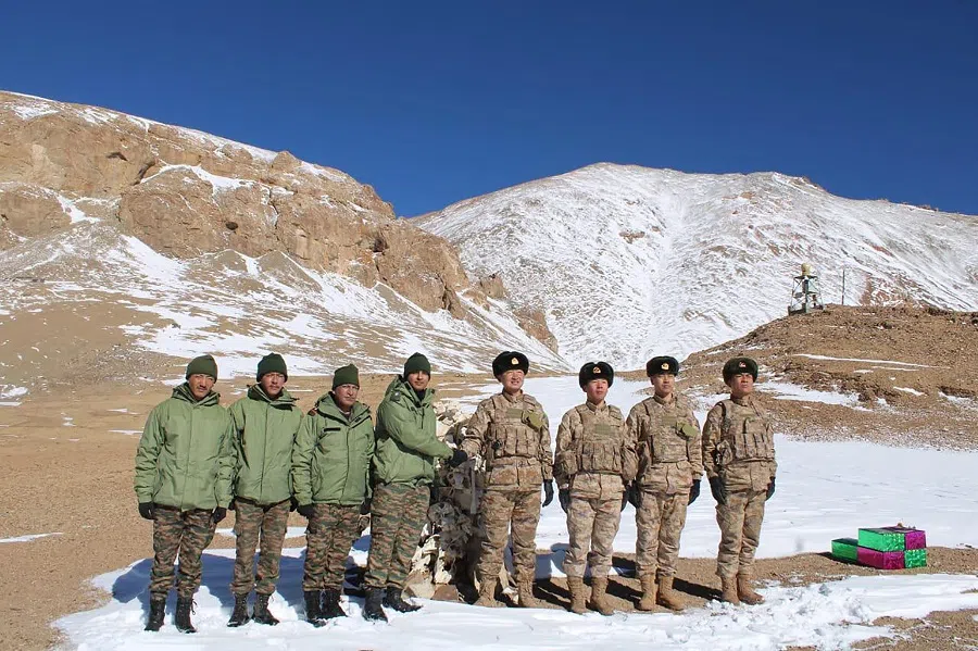Indian and Chinese army greet each other along the Line of Actual Control (LAC) near Karakoram pass in Ladakh on 31 October 2024, on the occasion of Diwali. (Indian Army/AFP)