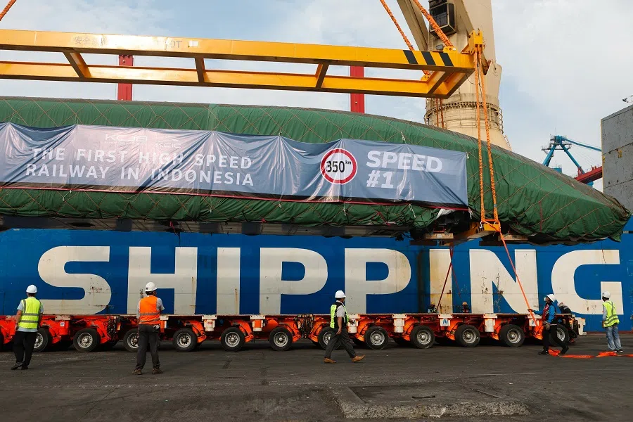 An Electric Multiple Unit high-speed train for a rail link project, which is part of China's Belt and Road Initiative, arrives at Tanjung Priok port during load in Jakarta, Indonesia, 2 September 2022. (Ajeng Dinar Ulfiana/Reuters)