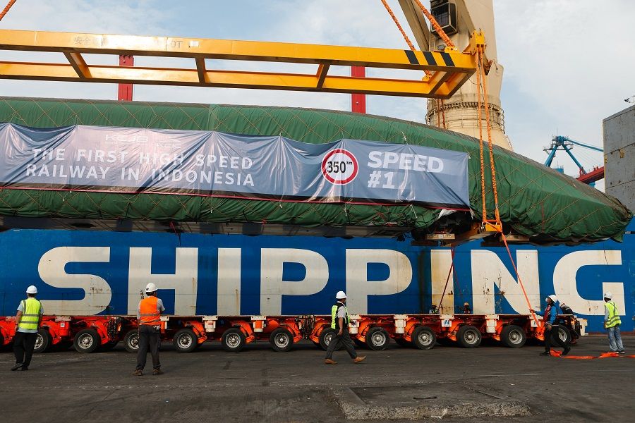 An Electric Multiple Unit high-speed train for a rail link project, which is part of China's Belt and Road Initiative, arrives at Tanjung Priok port during load in Jakarta, Indonesia, 2 September 2022. (Ajeng Dinar Ulfiana/Reuters)