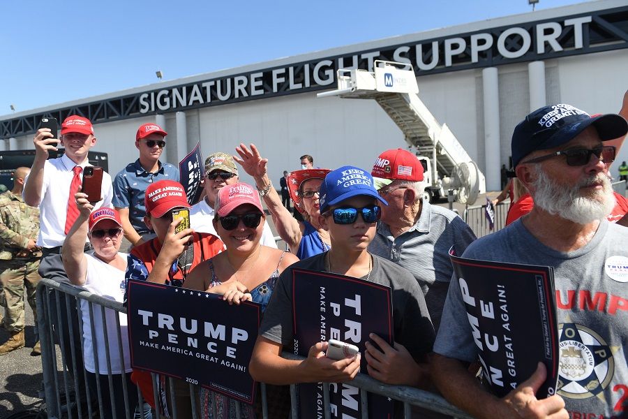 Supporters of US President Donald Trump wait for him to speak during a Campaign Coalitions Event with Florida Sheriffs at Tampa International Airport in Tampa, Florida, on 31 July 2020. (Saul Loeb/AFP)