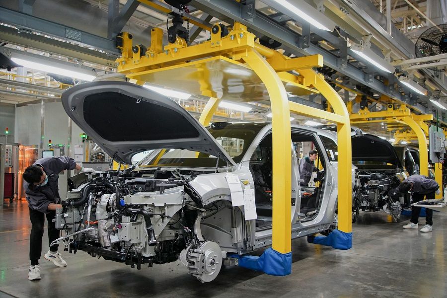 This photo taken on 27 March 2024 shows employees working on a car assembly line at a factory of Chinese carmaker Li Auto in Changzhou, in eastern China’s Jiangsu province.  (AFP)
