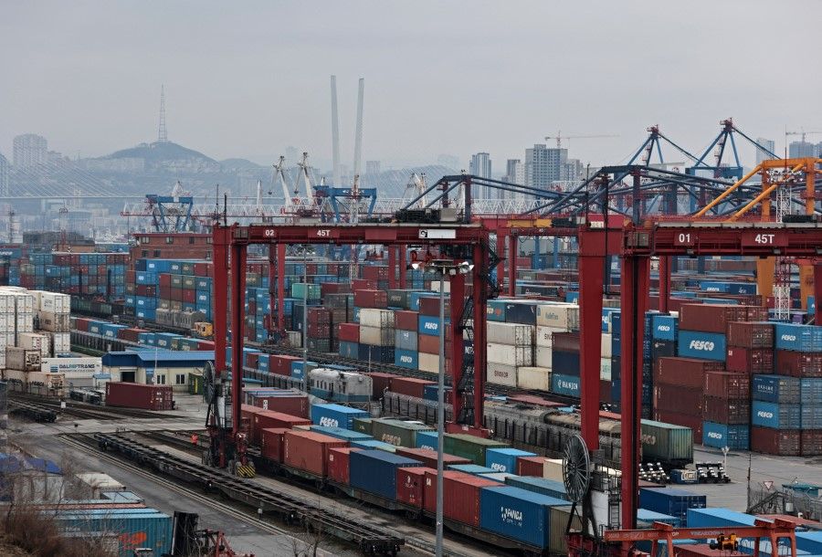 Shipping containers are stored at a commercial port in Vladivostok, Russia, 6 April 2023. (Tatiana Meel/Reuters)