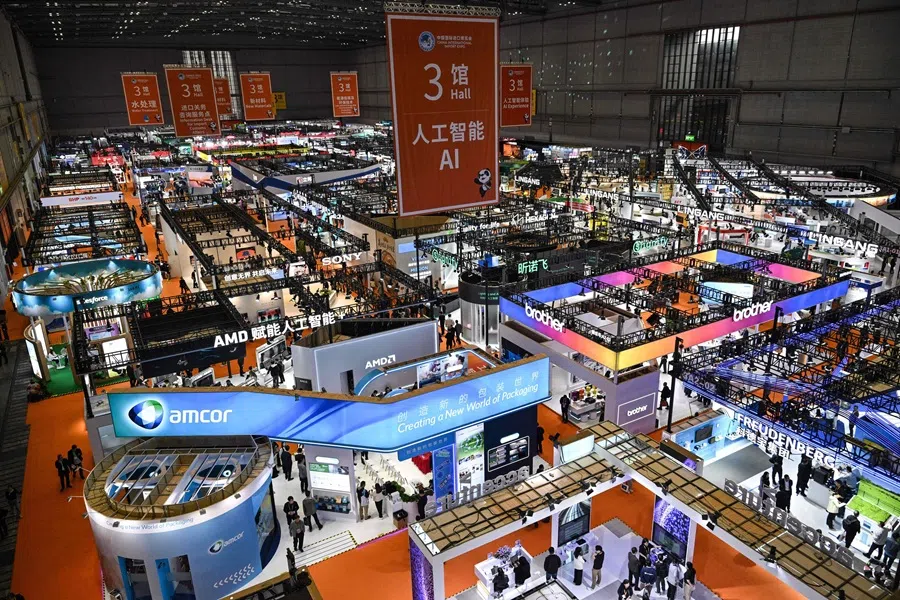 Visitors attend the 8th China International Import Expo (CIIE) in Shanghai on 7 November 2025. (Hector Retamal/AFP)