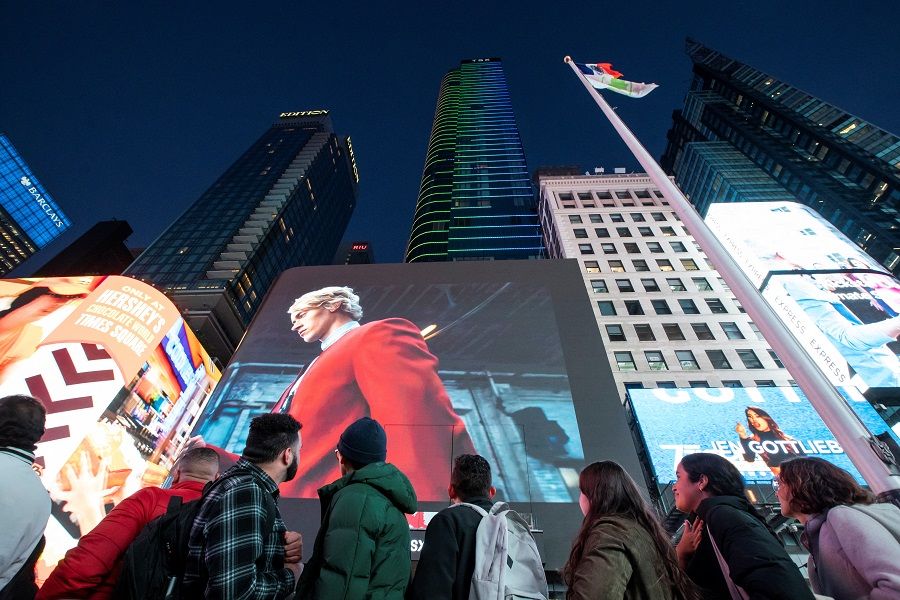 People watch a screen in Times Square during a promotional event for the movie Hunger Games: The Ballad of Songbirds and Snakes, in New York City, US, on 1 November 2023. (Eduardo Munoz/Reuters)