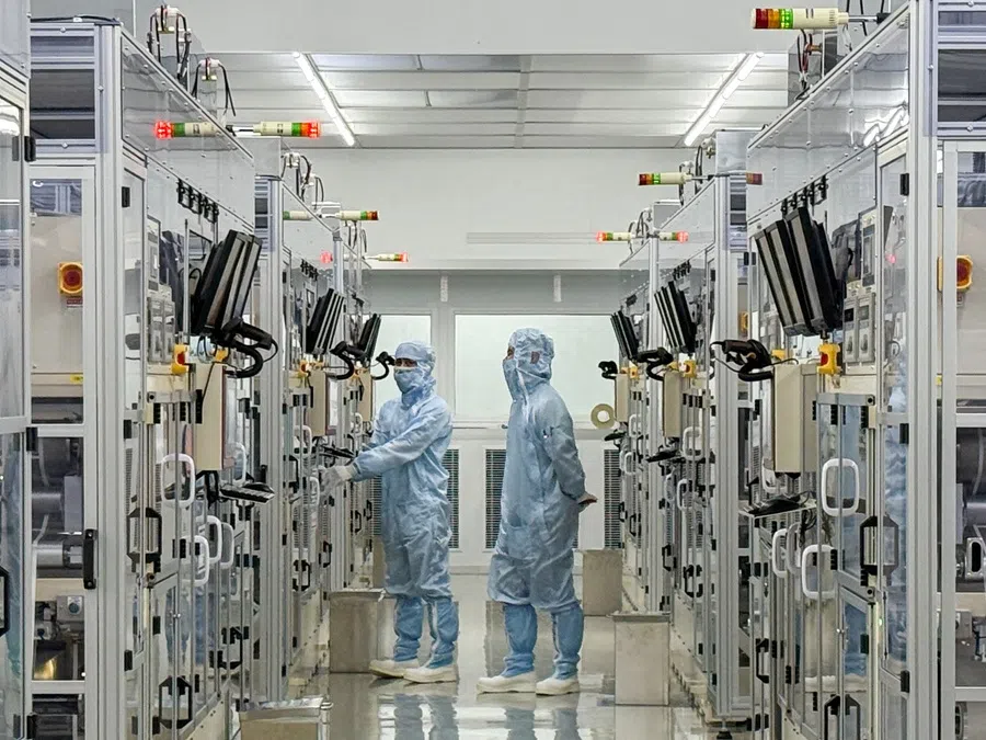 Workers are seen inside Yageo’s factory in Kaohsiung, Taiwan, 6 June 2025. (Wen-Yee Lee/Reuters)