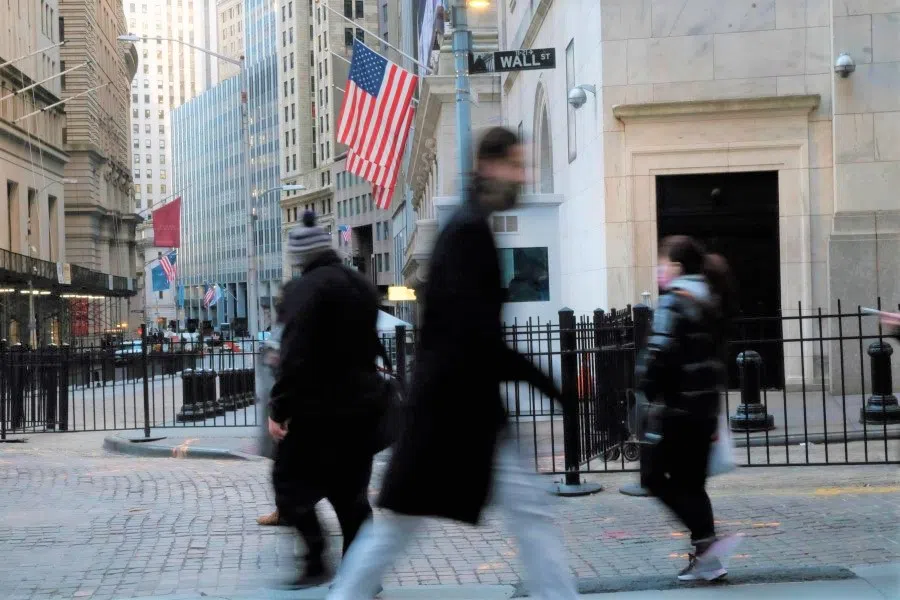 People walk by the New York Stock Exchange (NYSE) in the Financial District on 26 January 2022 in New York City. (Spencer Platt/AFP)