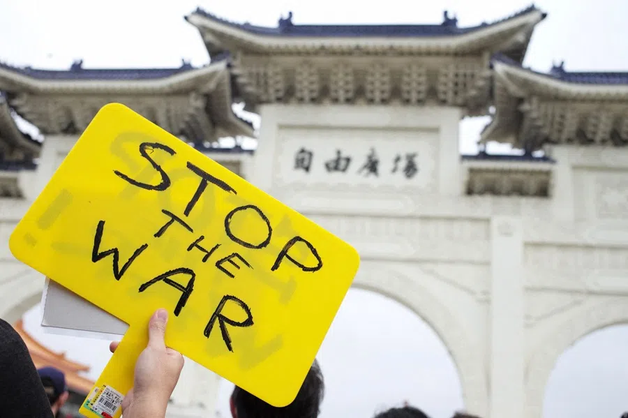 A Slavic people living in Taiwan holds a placard during a protest against Russia's military invasion of Ukraine at the Liberty Square outside the Chiang Kai-shek Memorial Hall in Taipei, Taiwan, on 6 March 2022. (Sam Yeh/AFP)