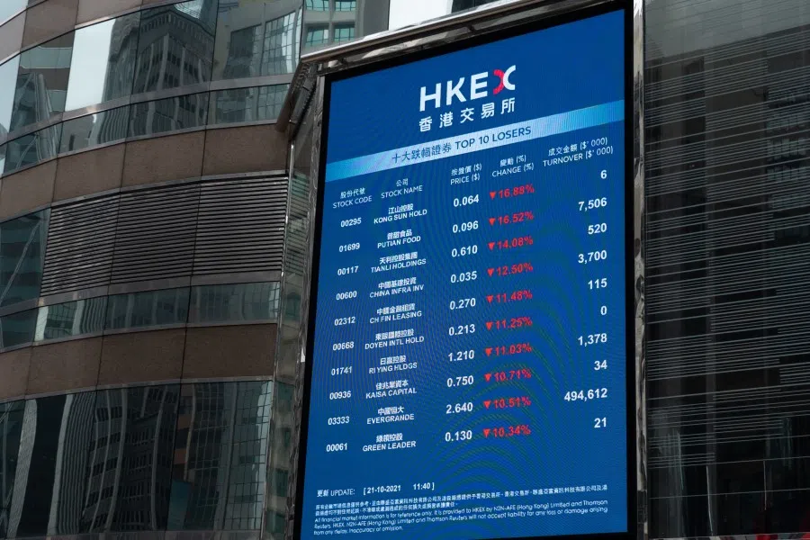 An electronic board displays various stock prices at Exchange Square in Hong Kong on 21 October 2021. (Bertha Wang/AFP)