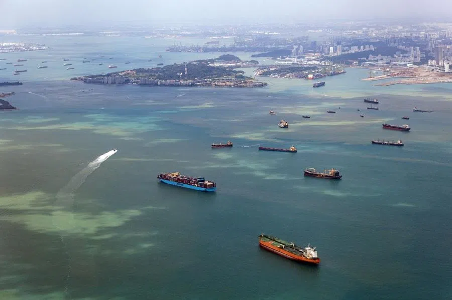 Container ships and bulk carriers off the shore of Singapore on 31 January 2026. (Seong Joon Cho/Bloomberg)