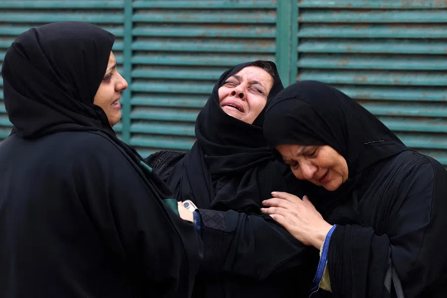 Palestinians mourn during the funeral of a relative, killed in an Israeli strike, in Gaza City on 10 October 2023. (Mohammed Abed/AFP)