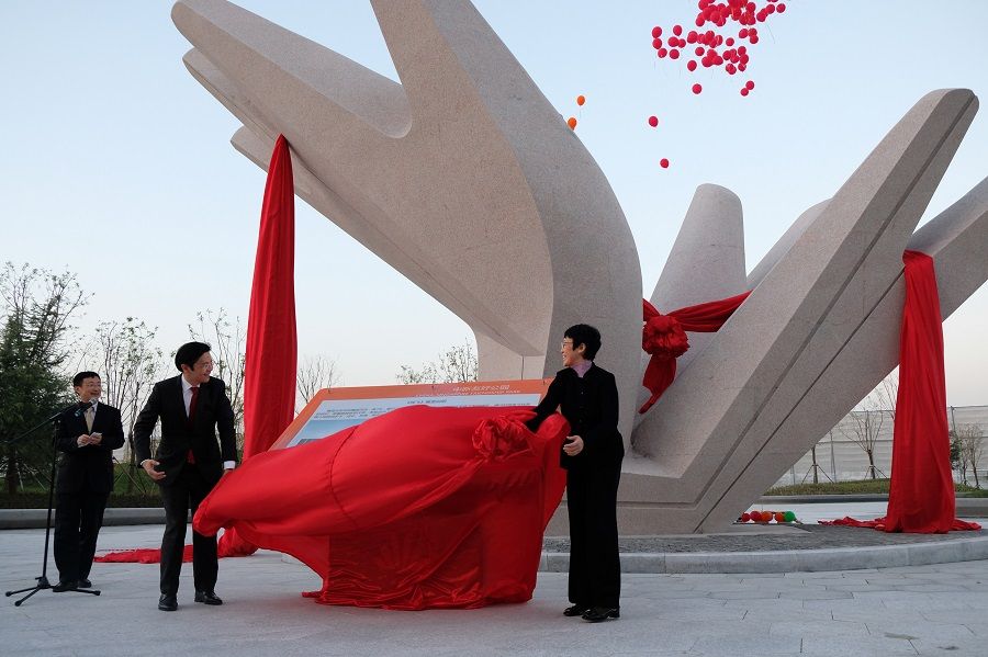 Minister for National Development Lawrence Wong (left) and China's vice minister for Housing and Urban-Rural Development Huang Yan unveiled a sculpture outside the China-Singapore Friendship Library, to commemorate the Tianjin Eco-city's 10th year anniversary. (SPH Media)