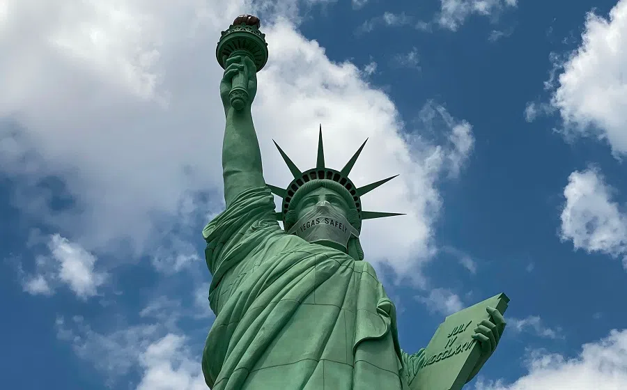 In this file photo taken on 29 August 2020, the Statue of Liberty replica in Las Vegas, Nevada is seen wearing a mask during the coronavirus pandemic. (Daniel Slim/AFP)