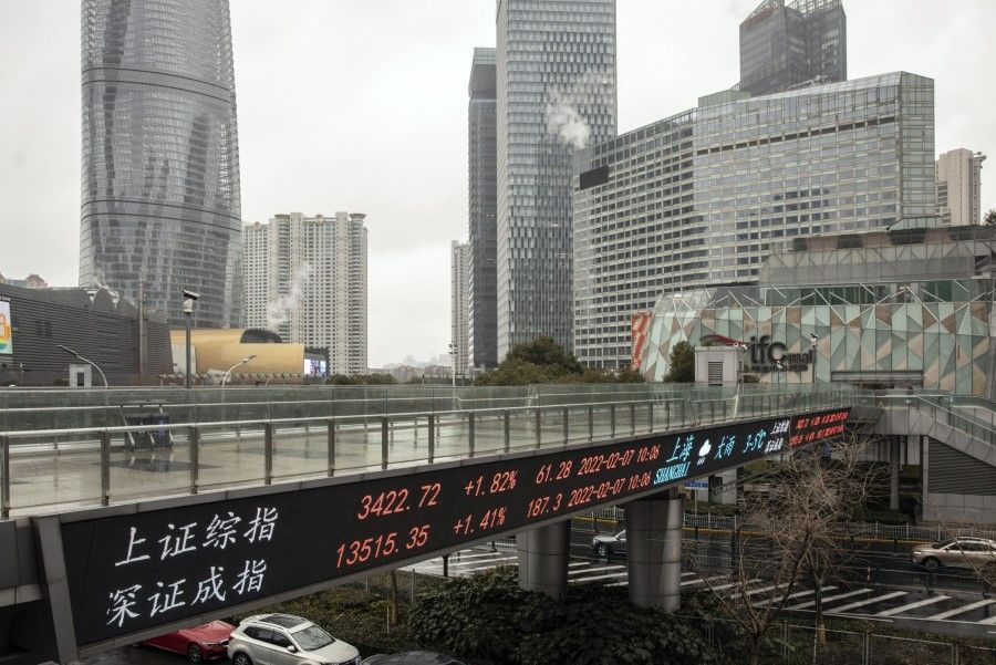 An electronic ticker displays stock figures in Pudong's Lujiazui Financial District in Shanghai, China, on 7 February 2022. (Qilai Shen/Bloomberg)