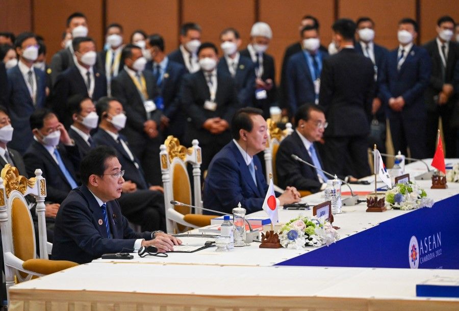 Japan's Prime Minister Fumio Kishida (left), South Korea's President Yoon Suk-yeol (centre), and China's Prime Minister Li Keqiang (right) take part in the ASEAN-Plus Three Summit as part of the 40th and 41st Association of Southeast Asian Nations (ASEAN) Summits in Phnom Penh on 12 November 2022. (Tang Chhin Sothy/AFP)