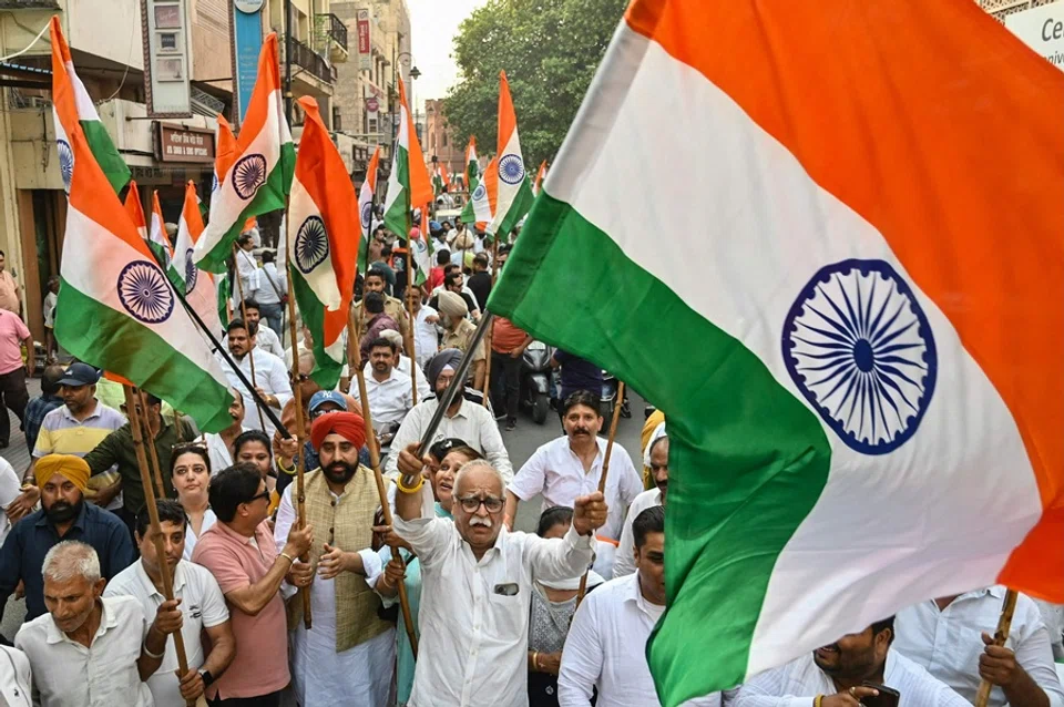 Bharatiya Janata Party (BJP) supporters waves Indian national flags during a Tiranga Yatra to celebrate the success of “Operation Sindoor” and to express solidarity with the Indian Army in Amritsar on 17 May 2025. (Narinder Nanu/AFP)