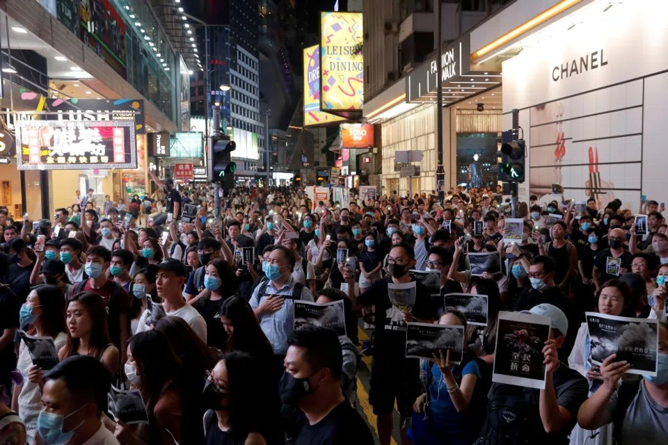 A march in Causeway Bay, in solidarity with the student protester who got shot by police with live ammunition in Hong Kong, China. (Susana Vera/Reuters)