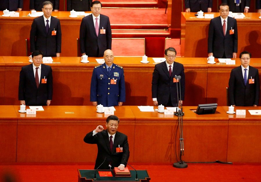 Chinese President Xi Jinping pledges an oath to the Constitution after being confirmed president for another term during the fifth plenary session of the National People's Congress (NPC) at the Great Hall of the People in Beijing, China, 17 March 2018. (Thomas Peter/File Photo/Reuters)