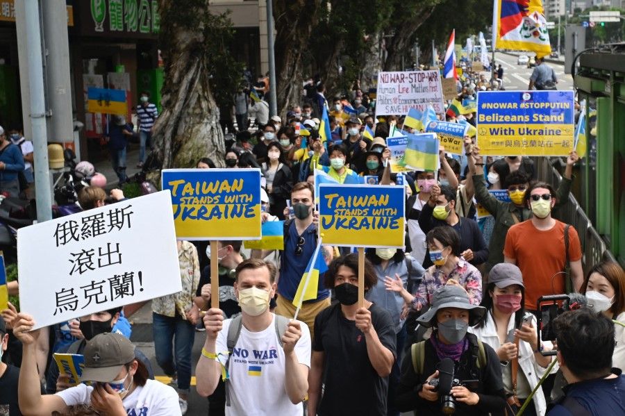 Taiwanese march on the streets protesting the war in Ukraine during a rally in Taipei on 13 March 2022. (Sam Yeh/AFP)