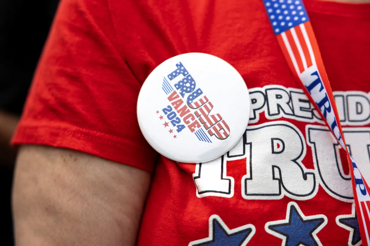 A supporter wears a button at a rally by Republican vice-presidential nominee JD Vance in his hometown of Middletown, Ohio, US, on 22 July 2024. (Megan Jelinger/Reuters)