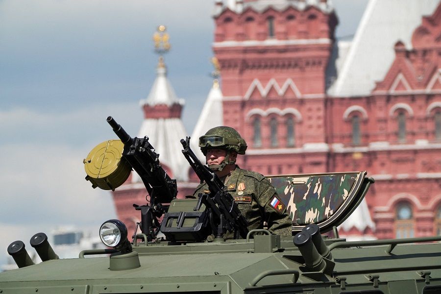 A Russian service member is seen atop of an armoured vehicle during a military parade on Victory Day, which marks the 78th anniversary of the victory over Nazi Germany in World War II, in Red Square in central Moscow, Russia, 9 May 2023. (Pelagiya Tikhonova/Moscow News Agency/Handout via Reuters)