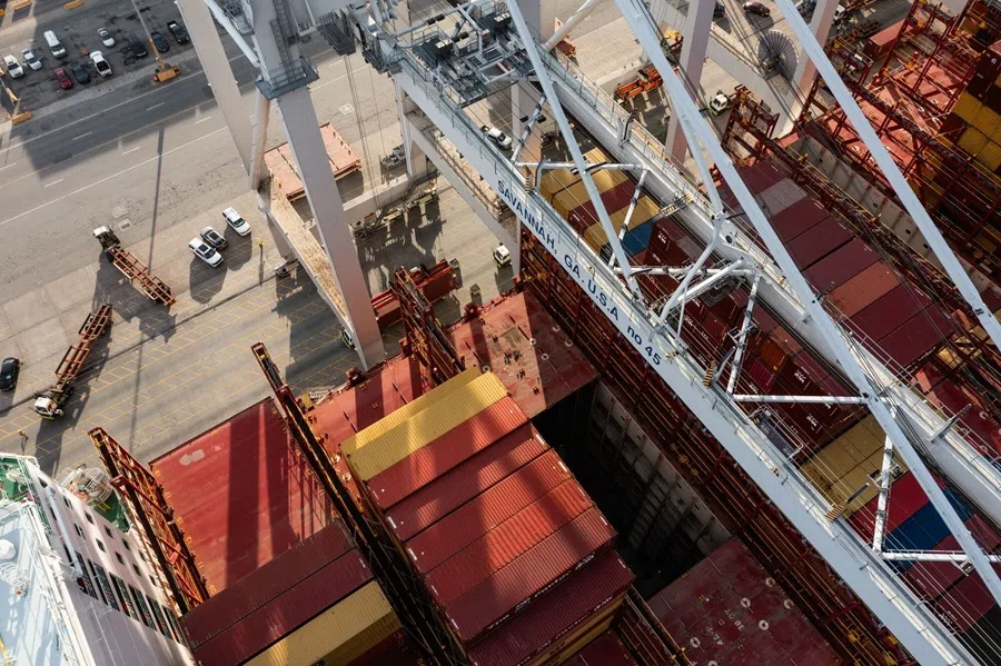 Cranes above containers on a ship at the Port of Savannah in Savannah, Georgia, US, on 11 June 2025. (Elijah Nouvelage/Bloomberg)