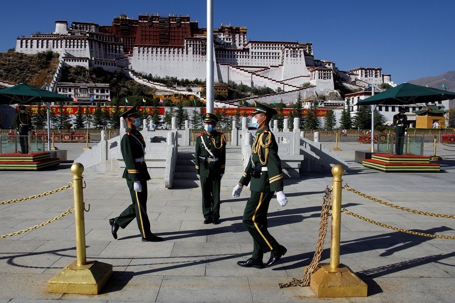 Paramilitary police officers perform a change of guard in front of Potala Palace in Lhasa, Tibet Autonomous Region, China, 15 October 2020. (Thomas Peter/Reuters)