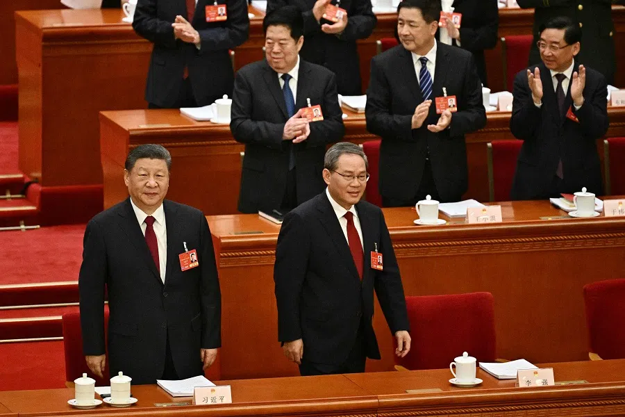China’s President Xi Jinping (left) and Premier Li Qiang attend the opening session of the National People’s Congress (NPC) at the Great Hall of the People in Beijing on 5 March 2025.