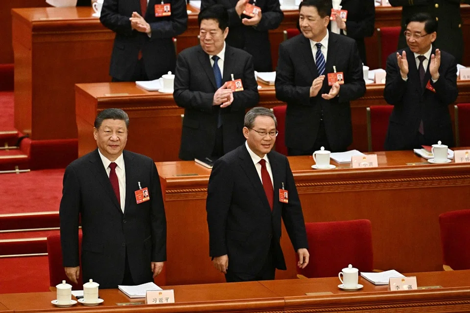 China’s President Xi Jinping (left) and Premier Li Qiang attend the opening session of the National People’s Congress (NPC) at the Great Hall of the People in Beijing on 5 March 2025. (Pedro Pardo/AFP)