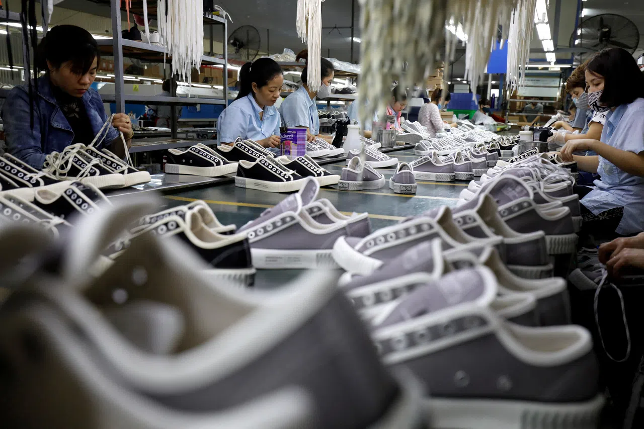 Employees work at a shoe factory for export in Hanoi, Vietnam, on 29 December 2020. (Kham/Reuters)
