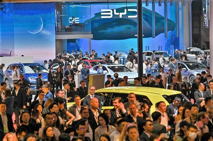 Visitors at the 20th Shanghai International Automobile Industry Exhibition in Shanghai, China, on 18 April 2023. (Hector Retamal/AFP)