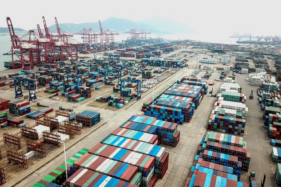 This aerial photo taken on 14 April 2020 shows containers stacked at a port in Lianyungang, Jiangsu, China amid a decline in foreign trade due to the Covid-19 pandemic. (STR/AFP)