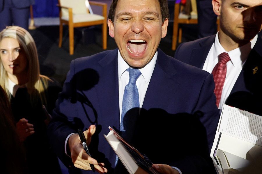Florida Governor Ron DeSantis greets attendees and signs books after his remarks as he makes his first trip to the early voting state of Iowa for a book tour stop at the Iowa State Fairgrounds in Des Moines, Iowa, US, 10 March 2023. (Jonathan Ernst/Reuters)
