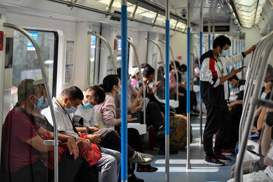 Passengers ride the subway in Wuhan, Hubei, China, on 28 September 2020. (Hector Retamal/AFP)