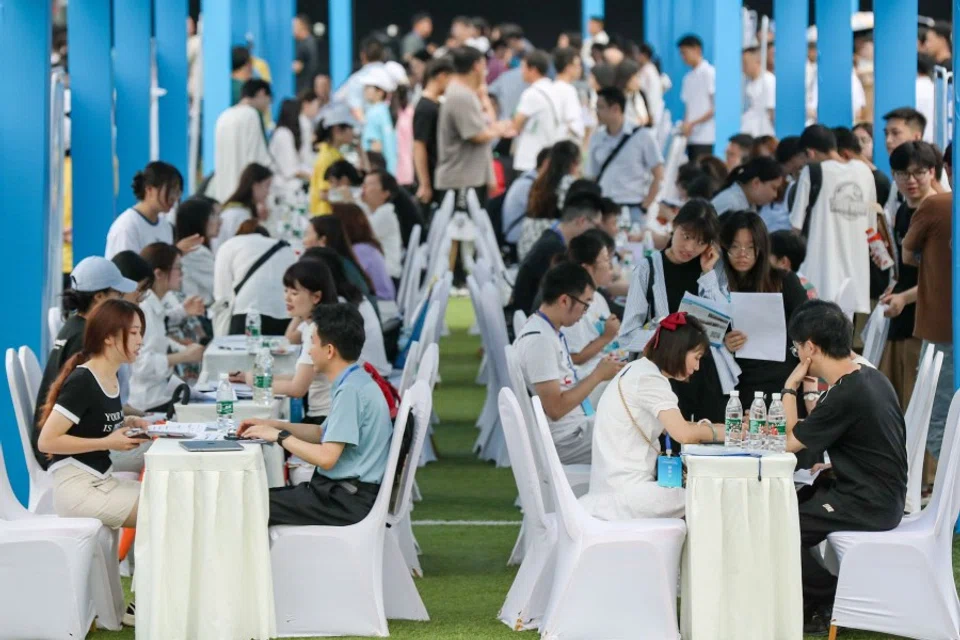 This photo taken on 14 June 2023 shows university graduates and youths attending a job fair in Yibin, in China's southwestern Sichuan province. (CNS/AFP)