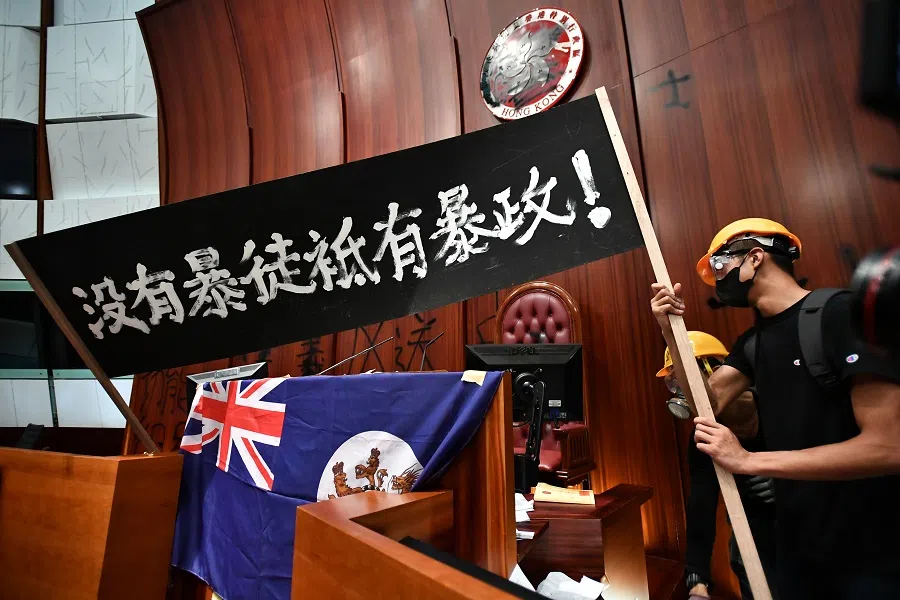 Protesters inside the chamber of the Hong Kong Legislative Council complex in Hong Kong on 1 July 2019, on its anniversary of its handover to Beijing. (SPH Media)