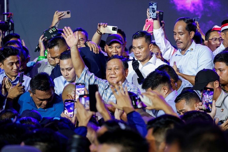 Indonesian presidential candidate Prabowo Subianto waves after delivering his speech at an event showing the quick-count results of the general election in Jakarta, Indonesia, 14 February 2024. (Willy Kurniawan/Reuters)