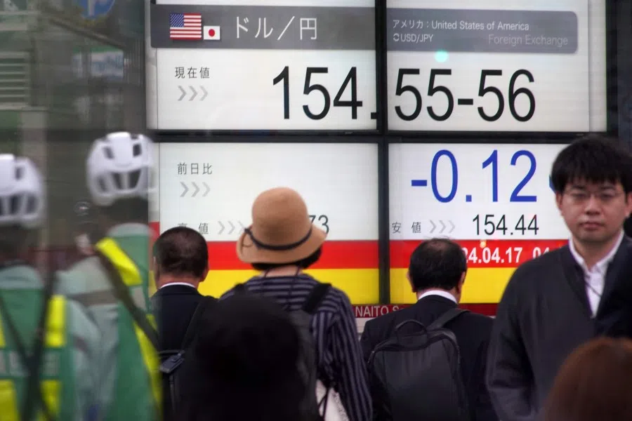 An electronic board displays the exchange rate of the Japanese yen against the US dollar along a street in Tokyo on 17 April 2024. (Kazuhiro Nogi/AFP)