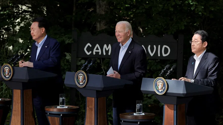 US President Joe Biden holds a joint press conference with Japanese Prime Minister Fumio Kishida and South Korean President Yoon Suk-yeol during the trilateral summit at Camp David near Thurmont, Maryland, US, on 18 August 2023. (Jim Bourg/Reuters)