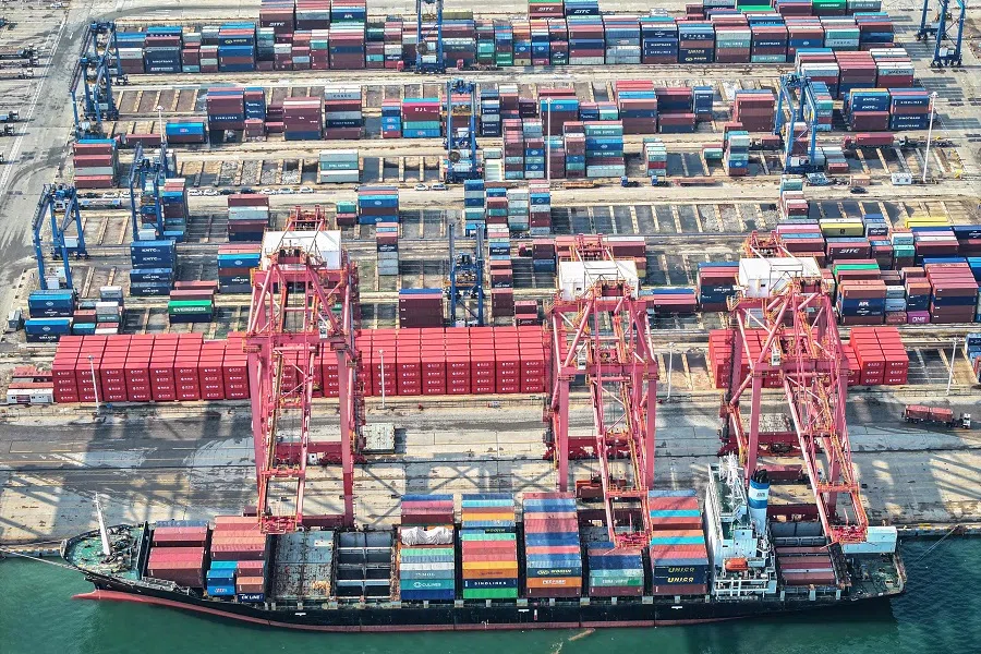 A cargo ship loaded with containers berths at a port in Lianyungang, in eastern China’s Jiangsu province on 7 August 2024. (AFP)