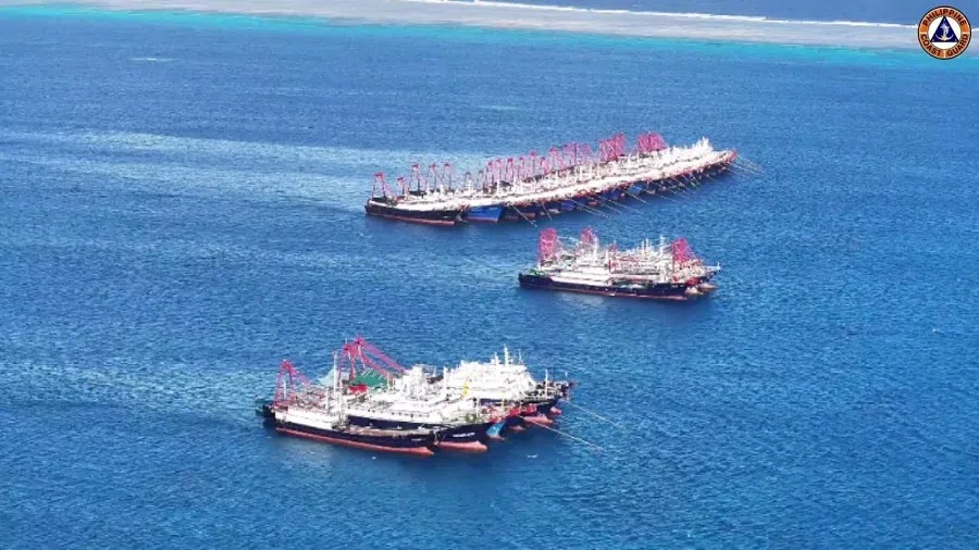 Chinese militia vessels operate at Whitsun Reef in the South China Sea, on 2 December 2023. (Philippine Coast Guard/Handout via Reuters)