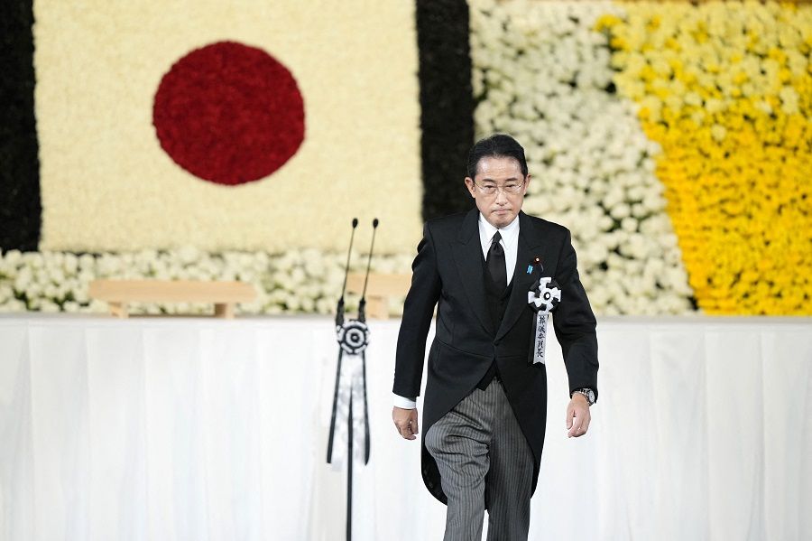 Japan's Prime Minister Fumio Kishida walks on stage during the state funeral for Japan's former prime minister Shinzo Abe in the Nippon Budokan in Tokyo, Japan, on 27 September 2022. (Franck Robichon/Pool/AFP)