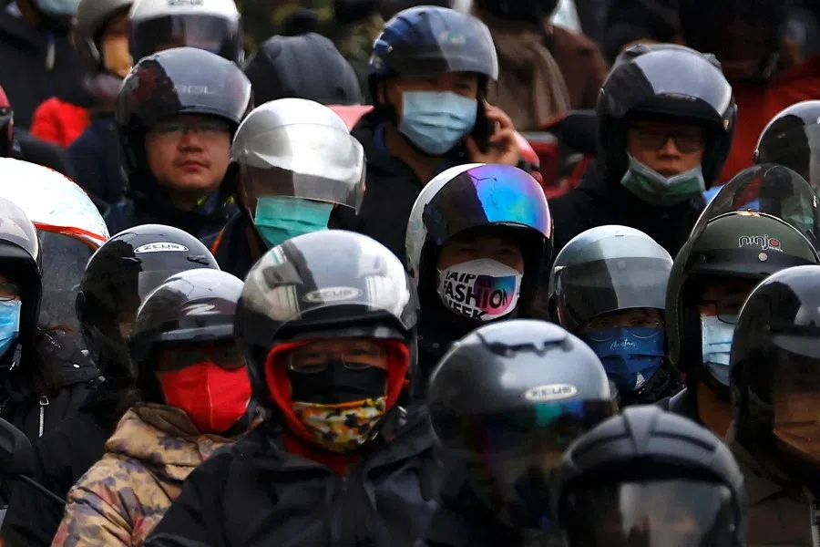 Commuters are seen during the rush hour traffic in Taipei, Taiwan, 17 January 2023. (Ann Wang/Reuters)
