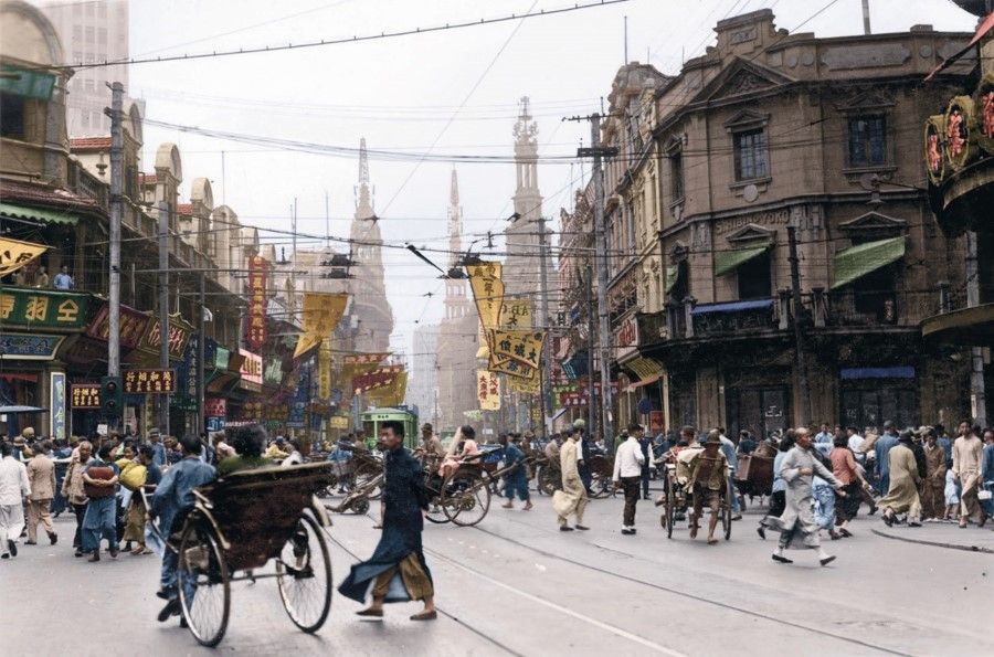 During the Nationalist period, Nanjing Road in Shanghai was one of the world's most famous commercial streets, with all kinds of stores, advertisements, and fluttering banners announcing items on sale or going cheap. Tobacconists, pharmacies, watch stores, metal factories all competed with one another.