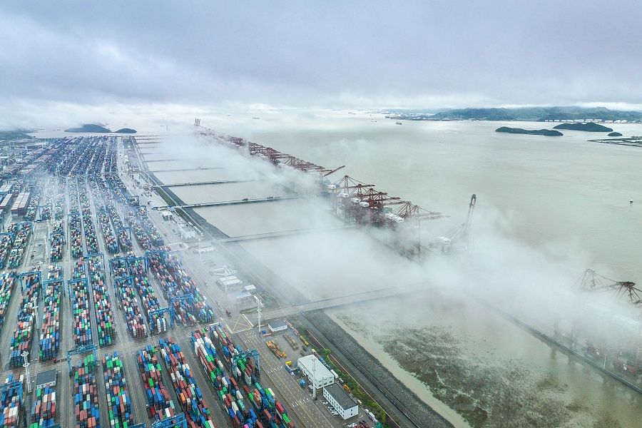 This aerial photo taken on 19 April 2023 shows cranes and shipping containers at Zhoushan port in Ningbo, Zhejiang province, China. (AFP)