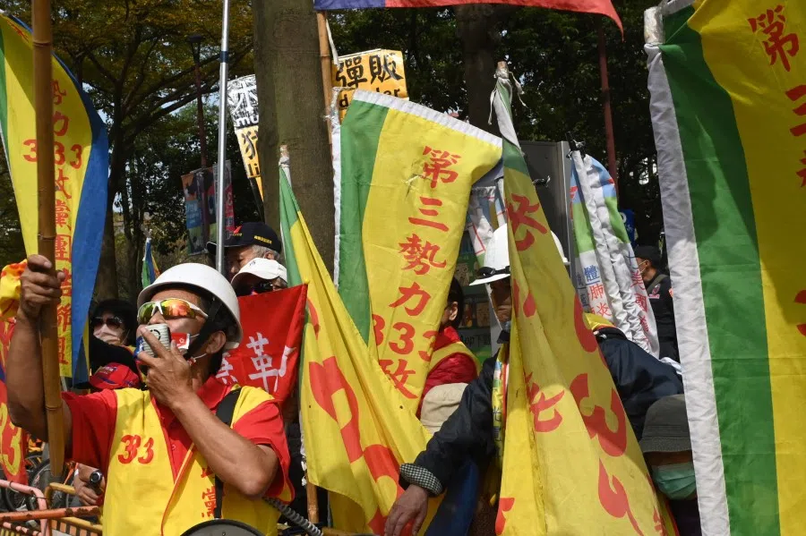 Pro-China activists chant slogans outside the hotel where former US secretary of state Mike Pompeo (not pictured) was delivering a speech in Taipei on 4 March 2022. (Sam Yeh/AFP)