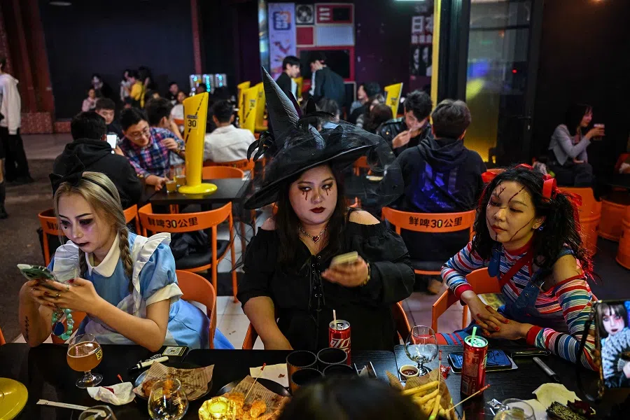 Costumed revellers visit Found 158, an area of bars, clubs and reataurants, ahead of Halloween in the district of Huangpu, in Shanghai, China on 27 October 2023. (Hector Retamal/AFP)